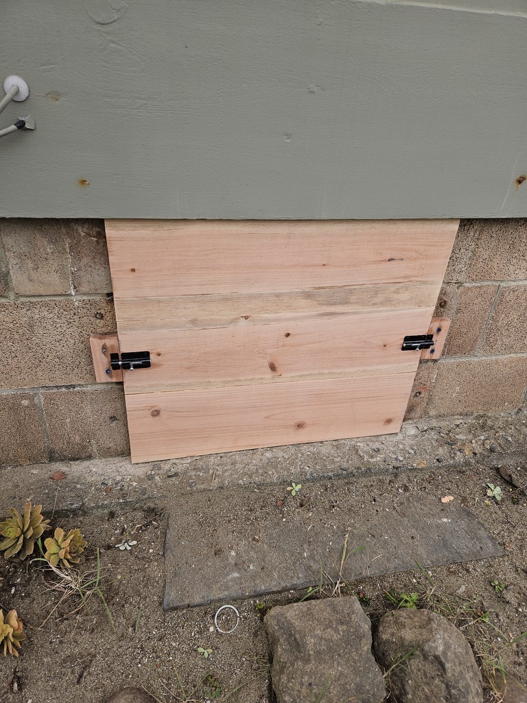redwood crawlspace door