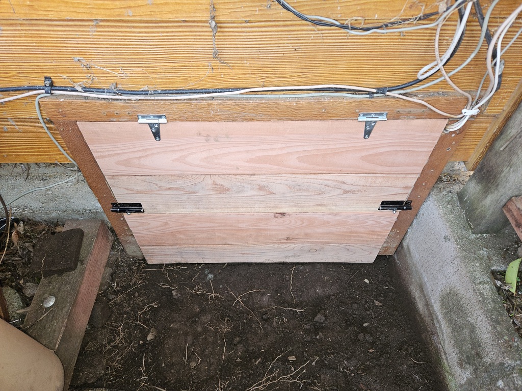 redwood crawlspace door